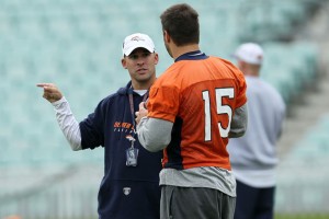 Former head coach of the Denver Broncos Josh McDaniels talks with Tim Tebow #15 during a team training session at The Brit Oval on October 29, 2010 in London, England. (Chris McGrath/Getty Images Europe)