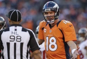 Peyton Manning comments to side judge Greg Bradley in the second quarter of an NFL football game, Sunday, Dec. 2, 2012, in Denver. (AP Photo/Joe Mahoney)